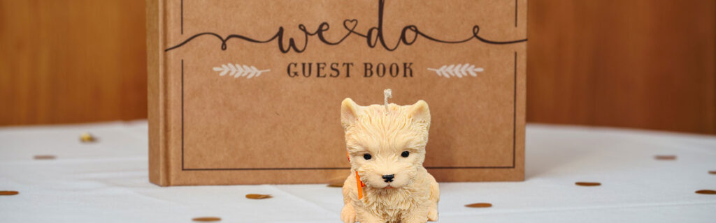 Wedding guest book with small dog figurine